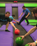 Men Grabbing Dodgeballs